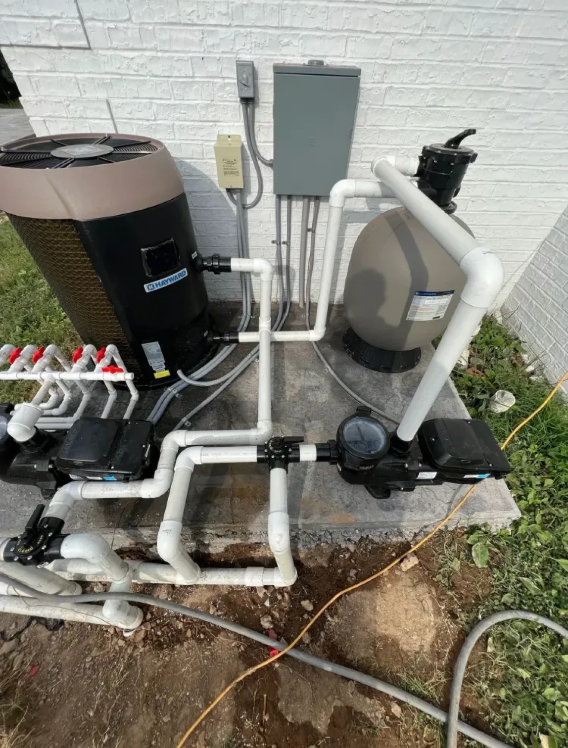Pool equipment with pipes and control panel.
