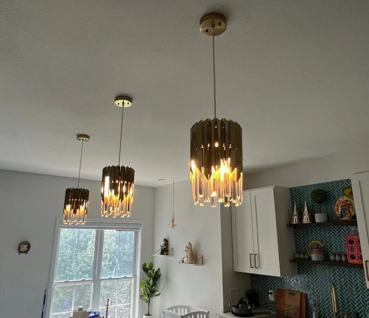 Three pendant lights in a modern kitchen.